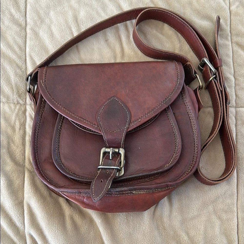 Brown Leather Crossbody Bag with Adjustable Strap and Flap Closure